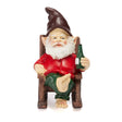 Garden gnome figurine wearing a red shirt and green pants, seated on a wooden chair and holding a green bottle.