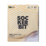 A bag of Sockerbit Sour Cherry Cola Swedish Candy features yellow diagonal stripes, bold black text, a Swedish flag icon, and some visible gluten free gummies. Net weight: 2.8oz (80g).