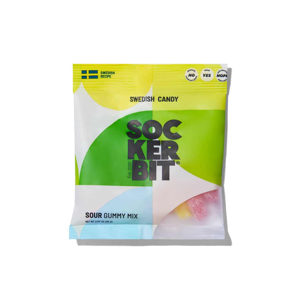 The Sockerbit Sour Gummy Mix Swedish Candy Bag 2.8oz features a green, yellow, and white geometric design with a Swedish flag on top left. Non-GMO label appears on the bag, showing assorted gummies inside.