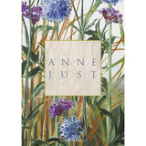 Illustration of purple and blue flowers with green leaves on FSC-certified paper. Anne Just is printed on a beige rectangle in the center, enhancing the elegant design of these beautiful Anne Just cards from the Card Pack: Anne Just Cardfolder 8 Cards w/Envelopes collection.