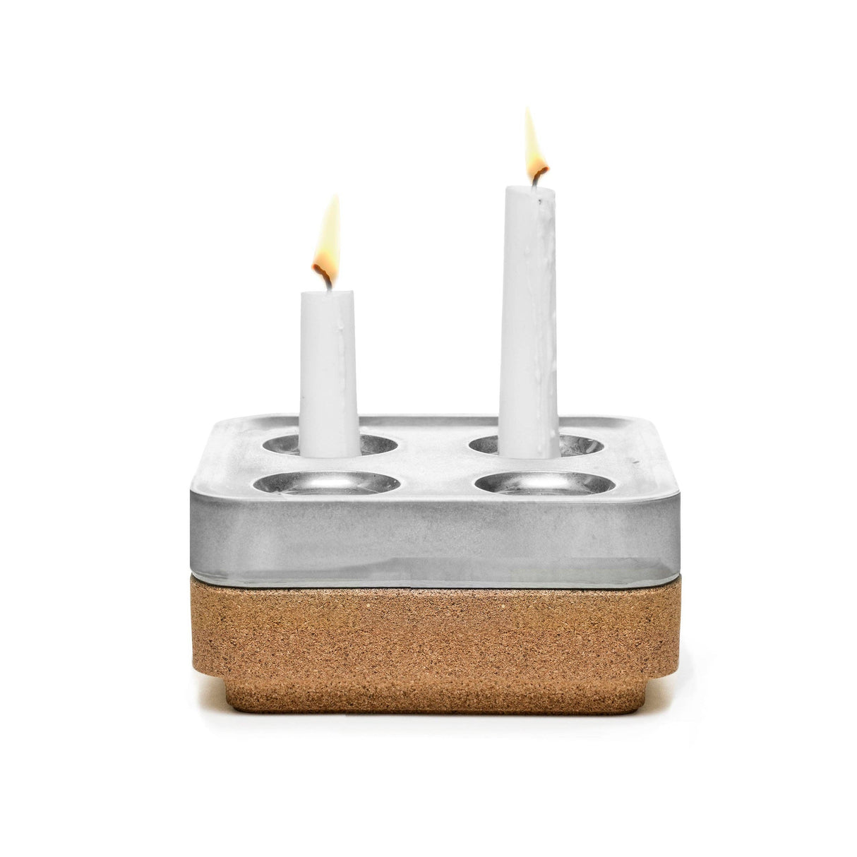 The Stumpastaken Fyran Four Candle Holder is a square, white powder-coated holder crafted from 100% recycled material, featuring Swedish design with four candle slots—perfect for sustainable decor.