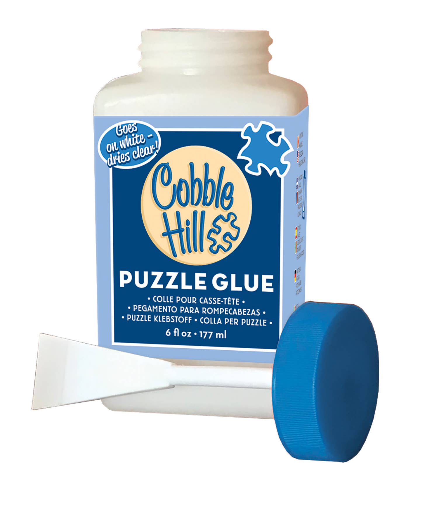 A 6 fl oz (177 ml) bottle of Cobble Hill's non-toxic Puzzle Glue, featuring a blue lid and an attached brush, labeled "Goes on white, dries clear," ideal for securing puzzles.