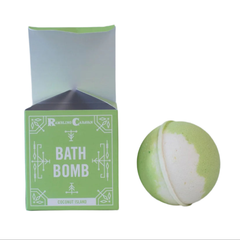 A green and white Bath Bomb: Coconut Island with a skin-nourishing formula is shown next to its open packaging on a plain white background.
