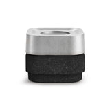The Stumpastaken Ettan Candle Holder is a square, minimalist container made from 100% recycled material with a white powder-coated finish (8.8x8.8x4 cm), photographed against a white background to highlight its sustainable design.