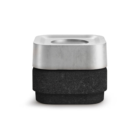 The Stumpastaken Ettan Candle Holder is a square, minimalist container made from 100% recycled material with a white powder-coated finish (8.8x8.8x4 cm), photographed against a white background to highlight its sustainable design.