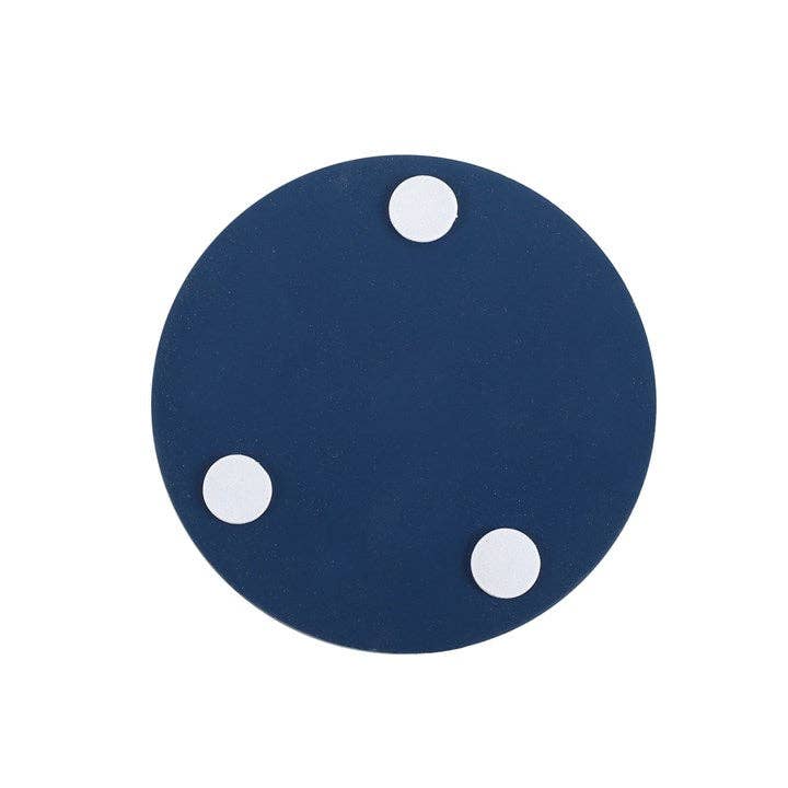 A round blue disc with three evenly spaced white circular pads attached to one side, reminiscent of the Gnome Sweet Gnome Coaster Set.