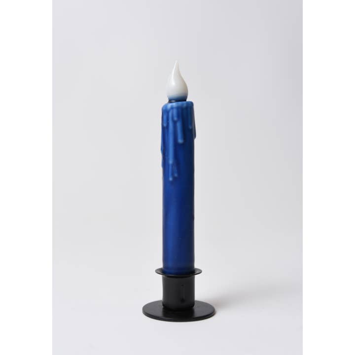 A 7" hand-dipped blue beeswax LED taper candle by LMS Wholesale, featuring a realistic melted wax drip effect, a white flame-shaped tip, and a black holder, is displayed against a plain white background.