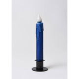 A 7" hand-dipped blue beeswax LED taper candle by LMS Wholesale, featuring a realistic melted wax drip effect, a white flame-shaped tip, and a black holder, is displayed against a plain white background.