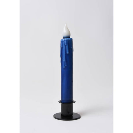A 7" hand-dipped blue beeswax LED taper candle by LMS Wholesale, featuring a realistic melted wax drip effect, a white flame-shaped tip, and a black holder, is displayed against a plain white background.