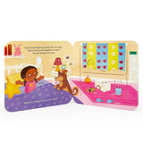 Colorful illustration of a young girl in pajamas with her smiling dog and labeled room items like a lamp, slippers, and toy chest—perfect for fans of the "Book: Peak a Flap God 12 Chunky Flaps" board book series.