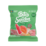 Green bag of sour candies with Swedish flag, colorful fruit illustrations, and visible text noting non-GMO ingredients.