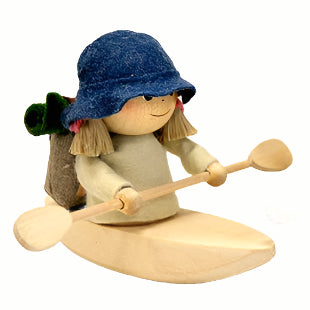 The Scandinavian Hiking Girl in Kayak figurine features two handcrafted figures in blue hats, seated in carved wooden kayaks with paddles and backpacks, ready for an adventure.