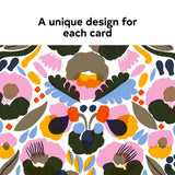The Marimekko Kukka Notecards 5x7 set features 16 cards and envelopes, each with a vibrant floral design in pink, yellow, orange, blue, green, and black—perfect for sending colorful notes.