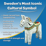 The Antique Inspired Swedish Dala Horse, white with gray feet (17cm), is Sweden's iconic symbol—hand-carved and painted to represent strength and courage.