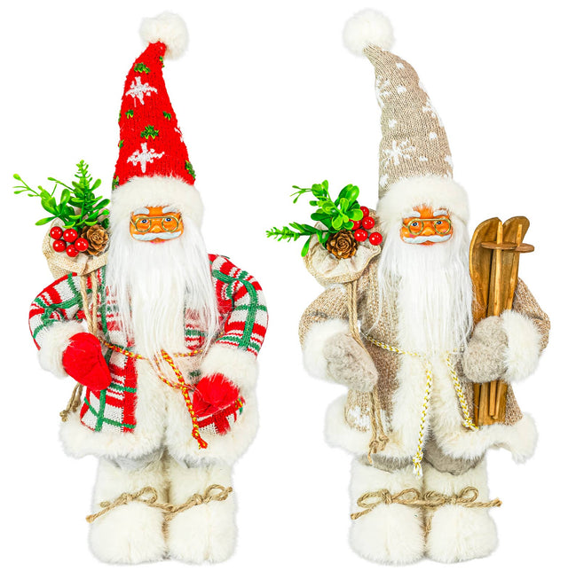 Two Santa figurines, one in beige with skis and green sprigs, the other in red with berry accents; both have fluffy boots and white beards.