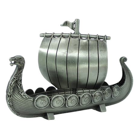 The Figurine: Norwegian Viking Ship with Sail Pewter 5″x3″ Table Decor by Faire - Scandinavian Specialties is a handcrafted keepsake that beautifully captures Scandinavian heritage, featuring a dragon-shaped prow, detailed shields along the side, and a single sail with a small flag atop—expertly crafted in pewter.