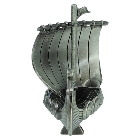 Front view of the Faire - Scandinavian Specialties Figurine: Norwegian Viking Ship with Sail Pewter 5″x3″ Table Decor, this handcrafted metallic model features a single sail, curved hull, and engraved details, proudly showcasing Scandinavian heritage against a plain white background.