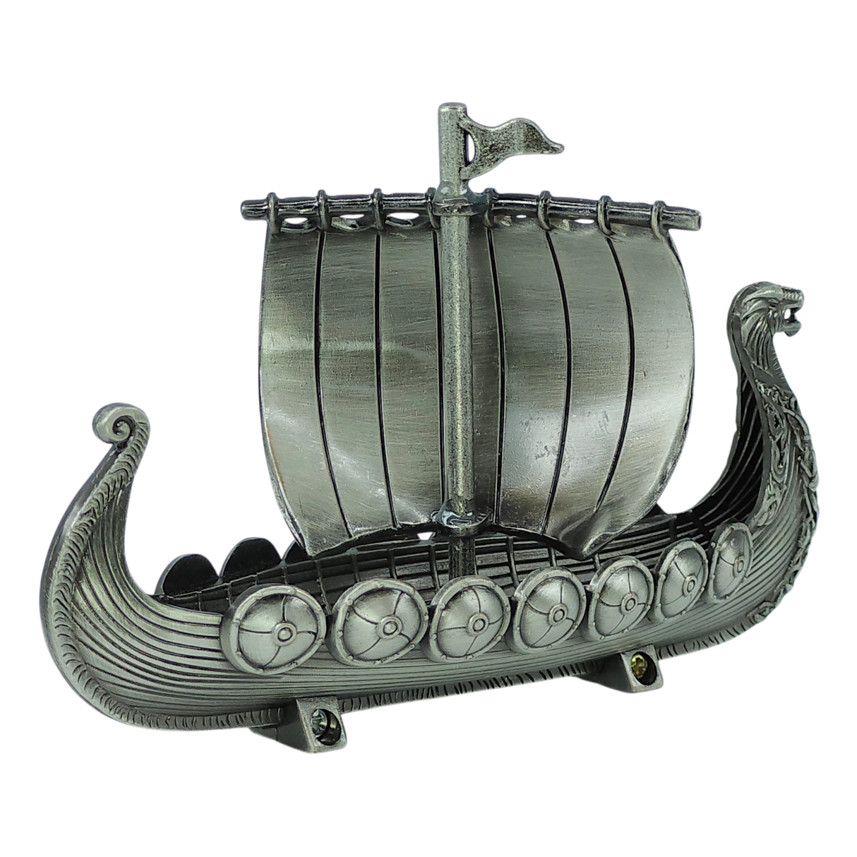 The Figurine: Norwegian Viking Ship with Sail Pewter 5″x3″ Table Decor by Faire - Scandinavian Specialties is a handcrafted Norwegian keepsake, featuring a dragon-headed prow, striped sail, detailed shields along the sides, and ornate carvings—all beautifully displayed against a plain white background.