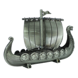 The Figurine: Norwegian Viking Ship with Sail Pewter 5″x3″ Table Decor by Faire - Scandinavian Specialties is a handcrafted Norwegian keepsake, featuring a dragon-headed prow, striped sail, detailed shields along the sides, and ornate carvings—all beautifully displayed against a plain white background.