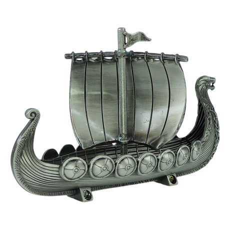 The Figurine: Norwegian Viking Ship with Sail Pewter 5″x3″ Table Decor by Faire - Scandinavian Specialties is a handcrafted Norwegian keepsake, featuring a dragon-headed prow, striped sail, detailed shields along the sides, and ornate carvings—all beautifully displayed against a plain white background.