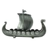 Handcrafted by Faire - Scandinavian Specialties, the Norwegian Viking Ship with Sail Pewter Figurine (5″x3″) features a silver-gray finish, a dragon-headed prow, decorated shields along the sides, and a single raised sail at the center. Intricate carvings embellish both the sides and prow, evoking the spirit of a classic Viking longship—making it an ideal table decor keepsake.