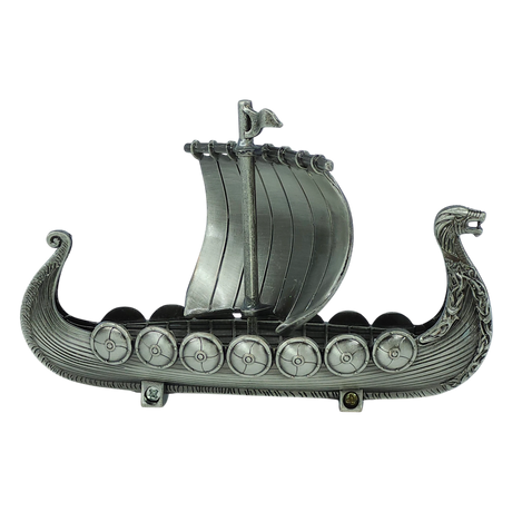 Handcrafted by Faire - Scandinavian Specialties, the Norwegian Viking Ship with Sail Pewter Figurine (5″x3″) features a silver-gray finish, a dragon-headed prow, decorated shields along the sides, and a single raised sail at the center. Intricate carvings embellish both the sides and prow, evoking the spirit of a classic Viking longship—making it an ideal table decor keepsake.