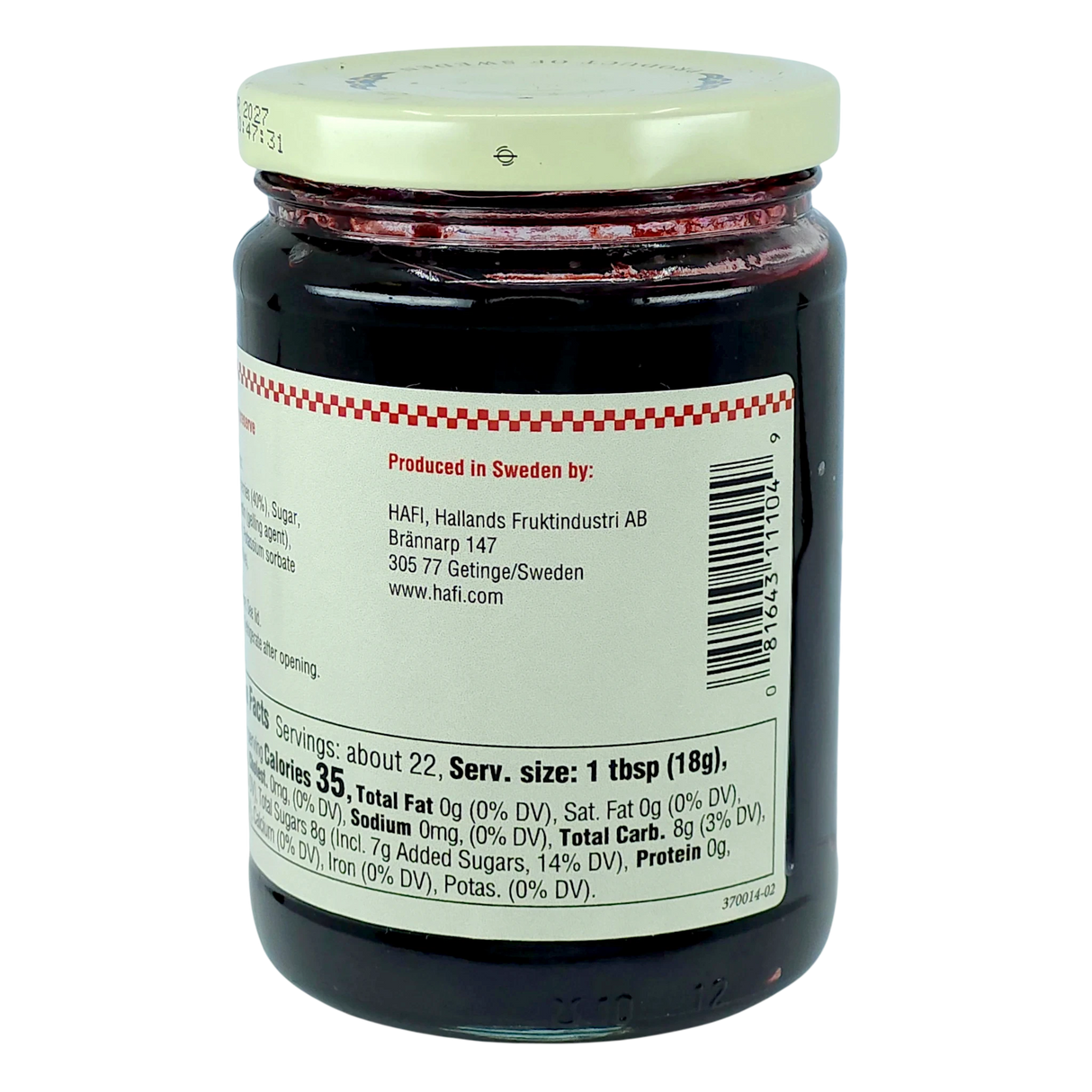 Glass jar with a white lid containing Swedish blueberry preserves, back facing forward to show the nutrition label and producer information.