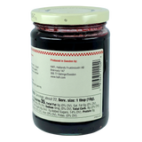 Glass jar with a white lid containing Swedish blueberry preserves, back facing forward to show the nutrition label and producer information.