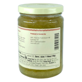 Glass jar containing light green gooseberry preserves. The white label displays nutrition facts, a barcode, and manufacturer information indicating origin from Sweden.