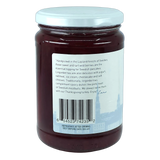 Glass jar of Scandinavian preserves with wild Swedish lingonberries, white lid, and a back label showing text, barcode, and serving suggestion images.