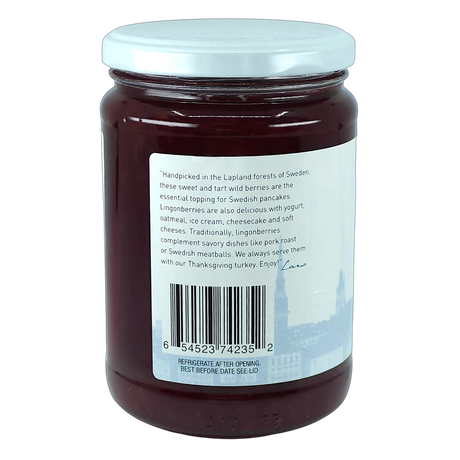 Glass jar of Scandinavian preserves with wild Swedish lingonberries, white lid, and a back label showing text, barcode, and serving suggestion images.