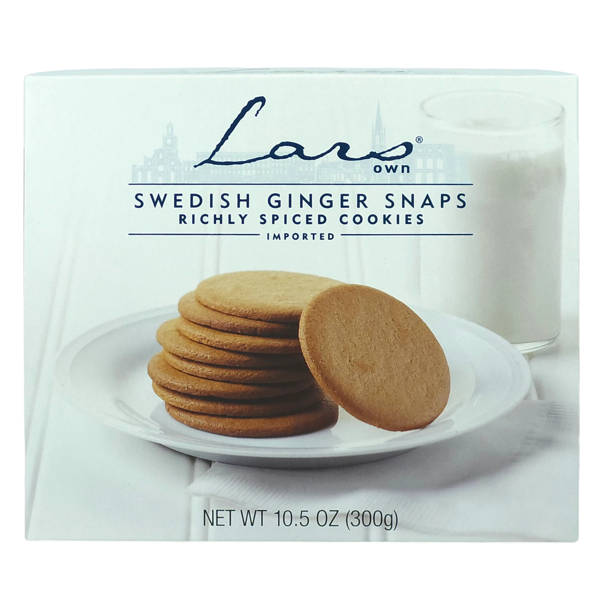 Plate of Swedish ginger snaps beside a glass of milk on a white surface; package labeled Lars Own pepparkakor spiced cookies is visible.