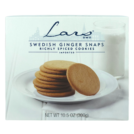 Plate of Swedish ginger snaps beside a glass of milk on a white surface; package labeled Lars Own pepparkakor spiced cookies is visible.