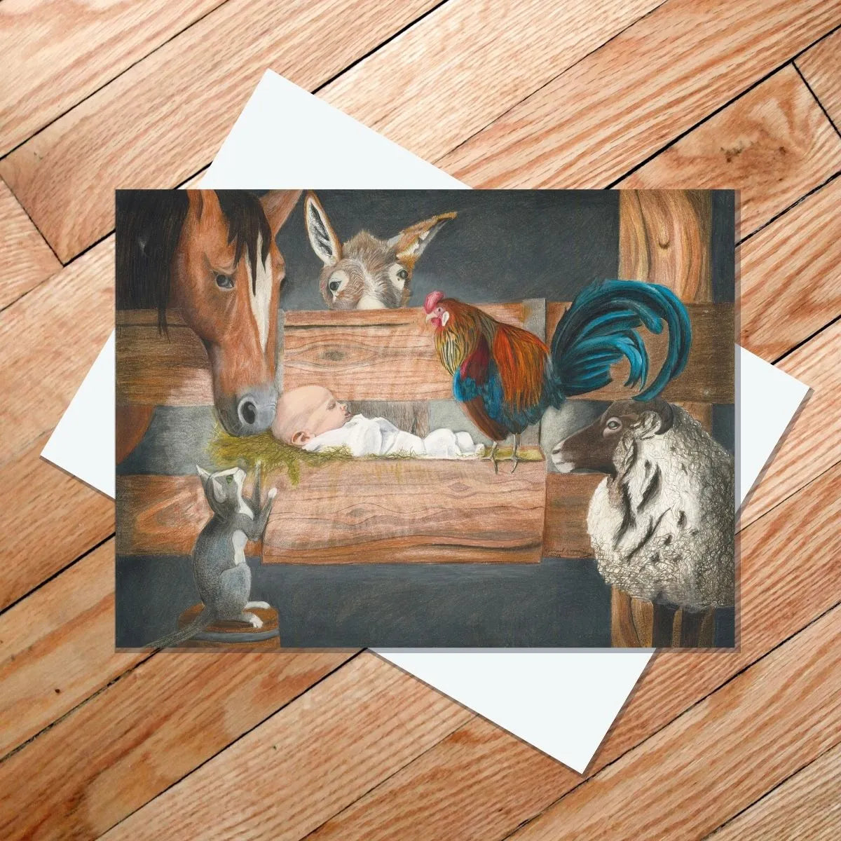 A baby rests in a wooden manger with a horse, donkey, rooster, sheep, and mouse—set on a wooden floor—featured on the "For Unto Us" 5x7 Card by Rachael Koppendrayer, perfect for Christian greeting cards.