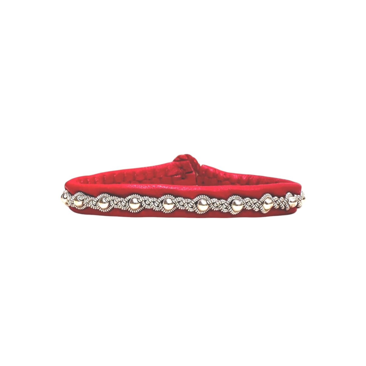 The Sami Frida bracelet, in red with pewter accents and a silver, rope-like and pearl bead design, is crafted along its reindeer skin length.