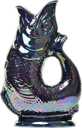 The Gluggle Jug: Gluggle Jug Lustre Made in Europe is a ceramic fish-shaped pitcher with a lustre glaze, open mouth spout, and tail-shaped handle.