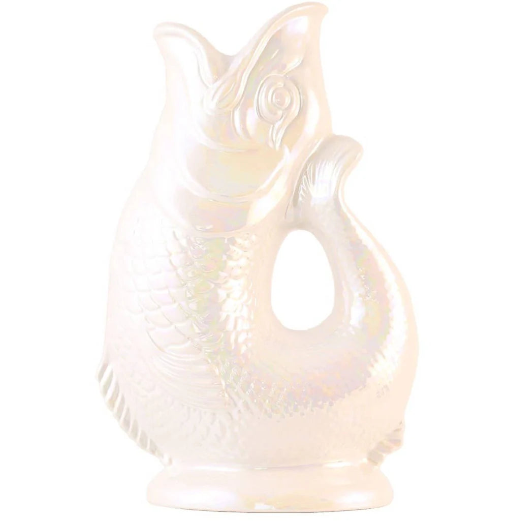 The Gluggle Jug: Gluggle Jug Lustre Made in Europe is a glossy white, fish-shaped pitcher with a lustre glaze and a handle formed by the fish’s curved tail.