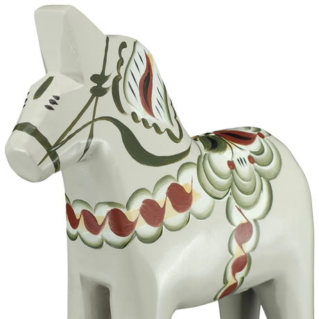 A close-up of the gray Swedish Dala Horse "Anders / Anniversary Series" (13 cm), handcrafted by Grannas Olsson in Sweden, features traditional painted patterns, showcasing classic Swedish craftsmanship.