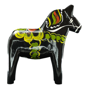 Black Swedish Dala horse with hand-painted green, yellow, red, and white decorative patterns on its body.