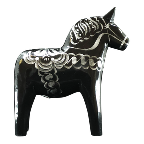 The Dala Horse: Black & Silver "Celebrate Series" by Grannas Olsson is a 13 cm handcrafted Swedish figurine, featuring silver patterns on black wood and inspired by traditional folk art.
