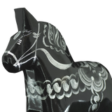 A close-up of the Grannas Olsson Black & Silver Swedish Dala Horse "Celebrate Series" (13 cm), handcrafted in Sweden, featuring detailed silver patterns on its body, displayed against a plain white background.