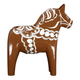 The Grannas Olsson Brown Swedish Dala Horse "Gingerbread" figurine, handcrafted in Sweden (13 cm/5 in), features white decorative patterns and stands upright on four legs, celebrating Scandinavian heritage.