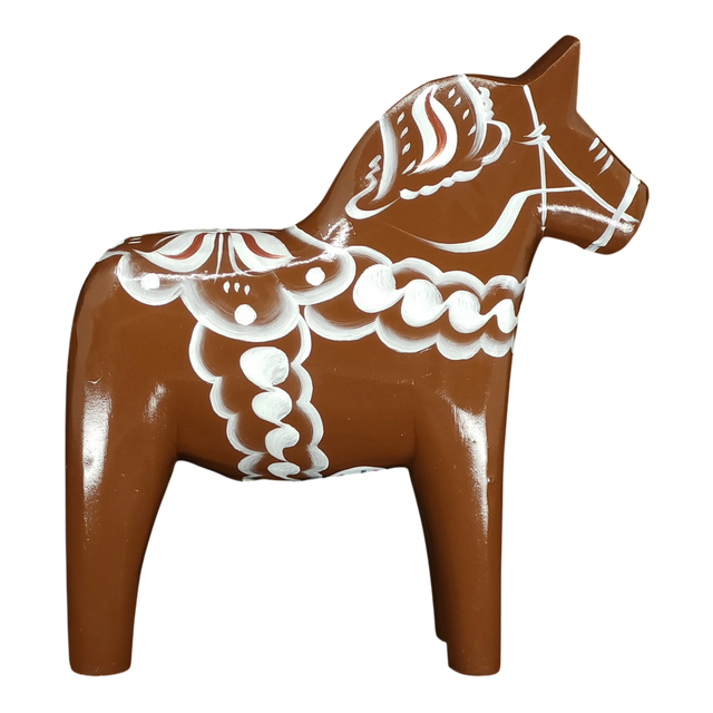 The Grannas Olsson Brown Swedish Dala Horse "Gingerbread" figurine, handcrafted in Sweden (13 cm/5 in), features white decorative patterns and stands upright on four legs, celebrating Scandinavian heritage.