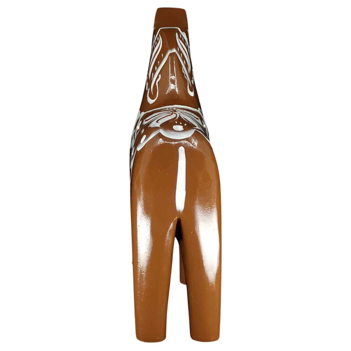 The Grannas Olsson Brown Swedish Dala Horse "Gingerbread" is a handcrafted 13 cm ceramic figurine with white Scandinavian patterns and a glossy finish, inspired by heritage design and viewed from behind.