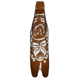 The Grannas Olsson Brown Swedish Dala Horse "Gingerbread" (13 cm), handcrafted in Sweden, features white abstract and butterfly-like painted patterns inspired by Scandinavian heritage, displayed from above on a white background.