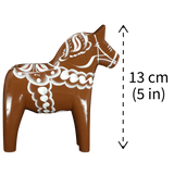 The Dala Horse: Brown Swedish "Gingerbread" by Grannas Olsson, handcrafted in Sweden, stands 13 cm (5 in) tall, showcasing classic Swedish woodcarving tradition.