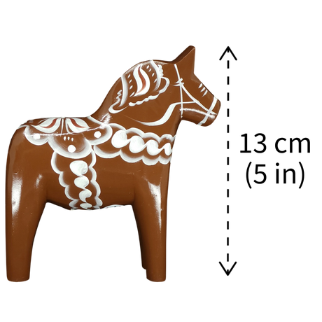 The Dala Horse: Brown Swedish "Gingerbread" by Grannas Olsson, handcrafted in Sweden, stands 13 cm (5 in) tall, showcasing classic Swedish woodcarving tradition.