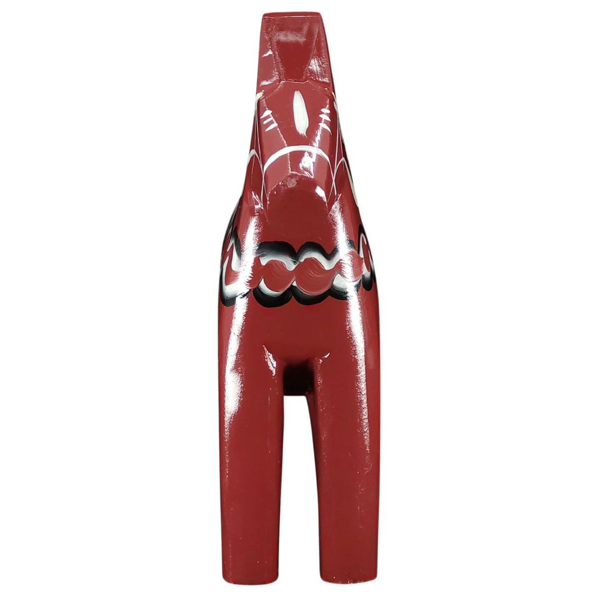 The Grannas Olsson Dala Horse: Burgundy "Maria / Anniversary Series" (15 cm) displays Swedish craftsmanship with white and black hand-painted patterns around its midsection and back. Handcrafted in Sweden.
