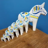 Dala Horse: White Swedish Dala Horse with Blue and Yellow "Swedish Flag Colors | Grannas A. Olsson Made in Sweden