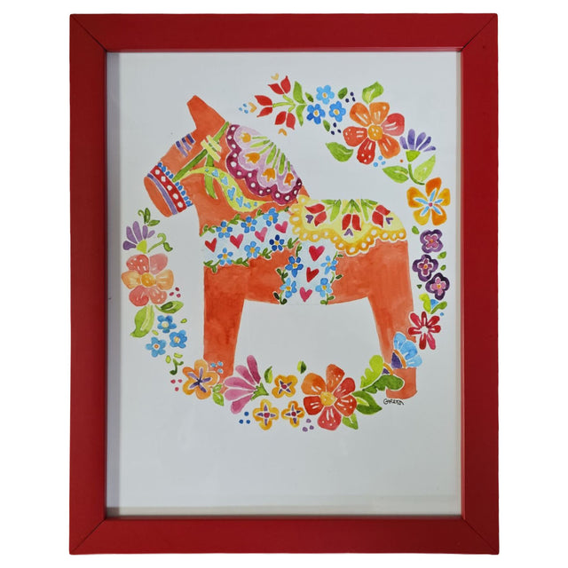 Autographed "Dala Horse" watercolor print by Greta Lann, featuring a colorful floral Swedish Dala Horse in a vibrant red custom frame.
